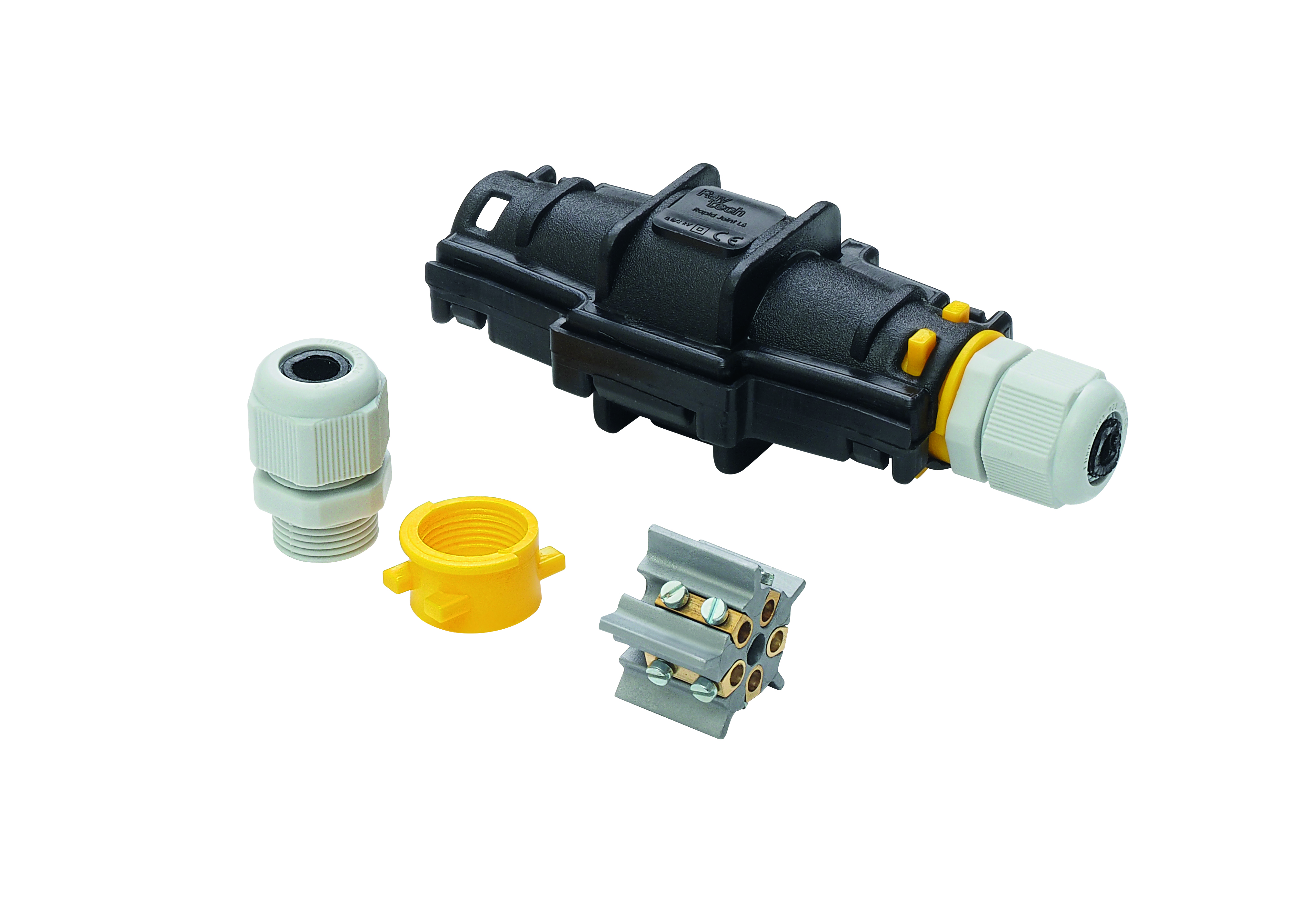 Längliche schwarze Verbindungsmuffe, geschlossen. Davor liegen ein Klemmblock und Verschlüsse.