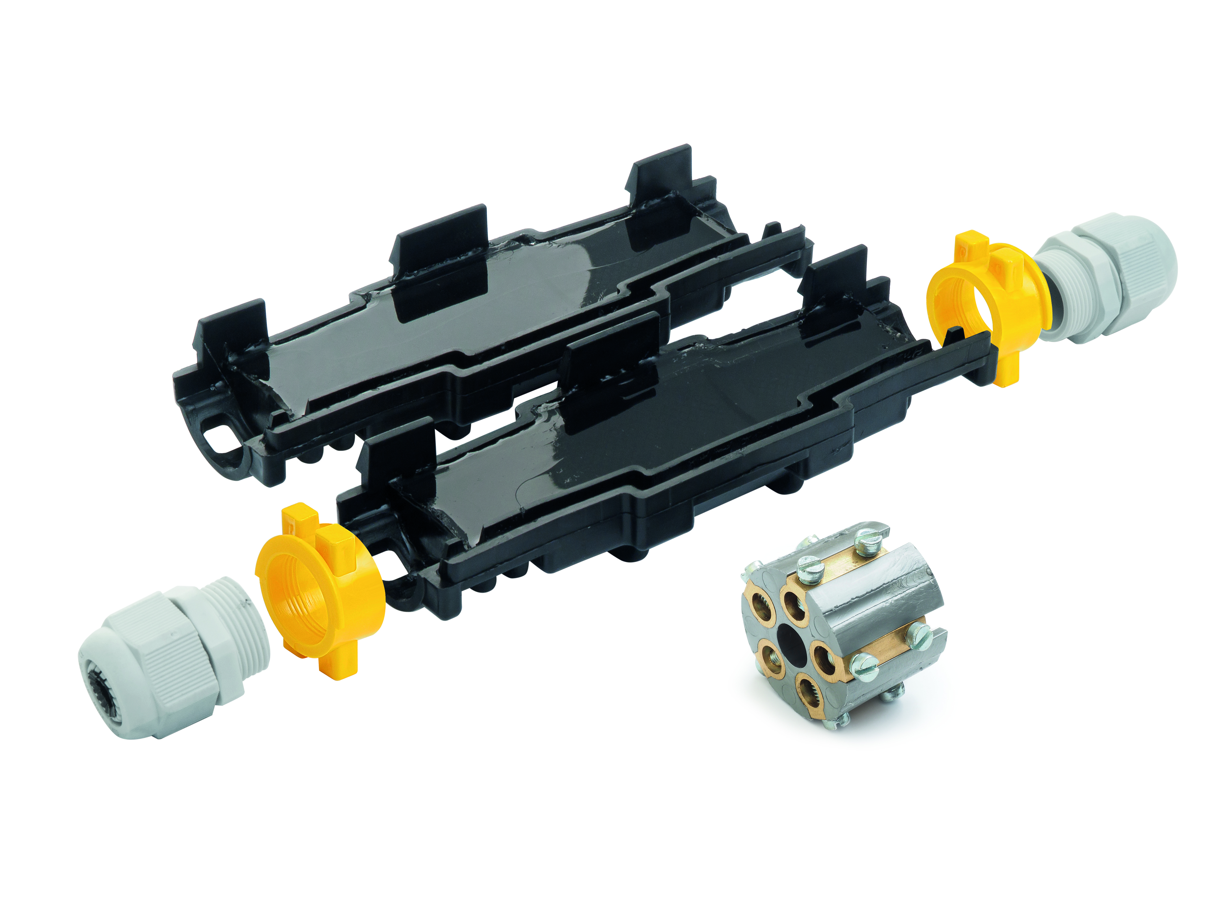 Längliche schwarze Verbindungsmuffe mit Gel gefüllt, halb geöffnet. Davor liegt ein Klemmblock.