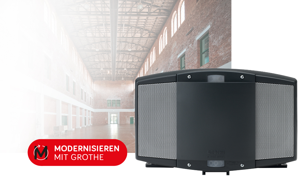 Power-Signalgeber frontal, im Hintergrund ein Bild einer leeren Industriehalle; vorne der "Modernisieren mit Grothe"-Button