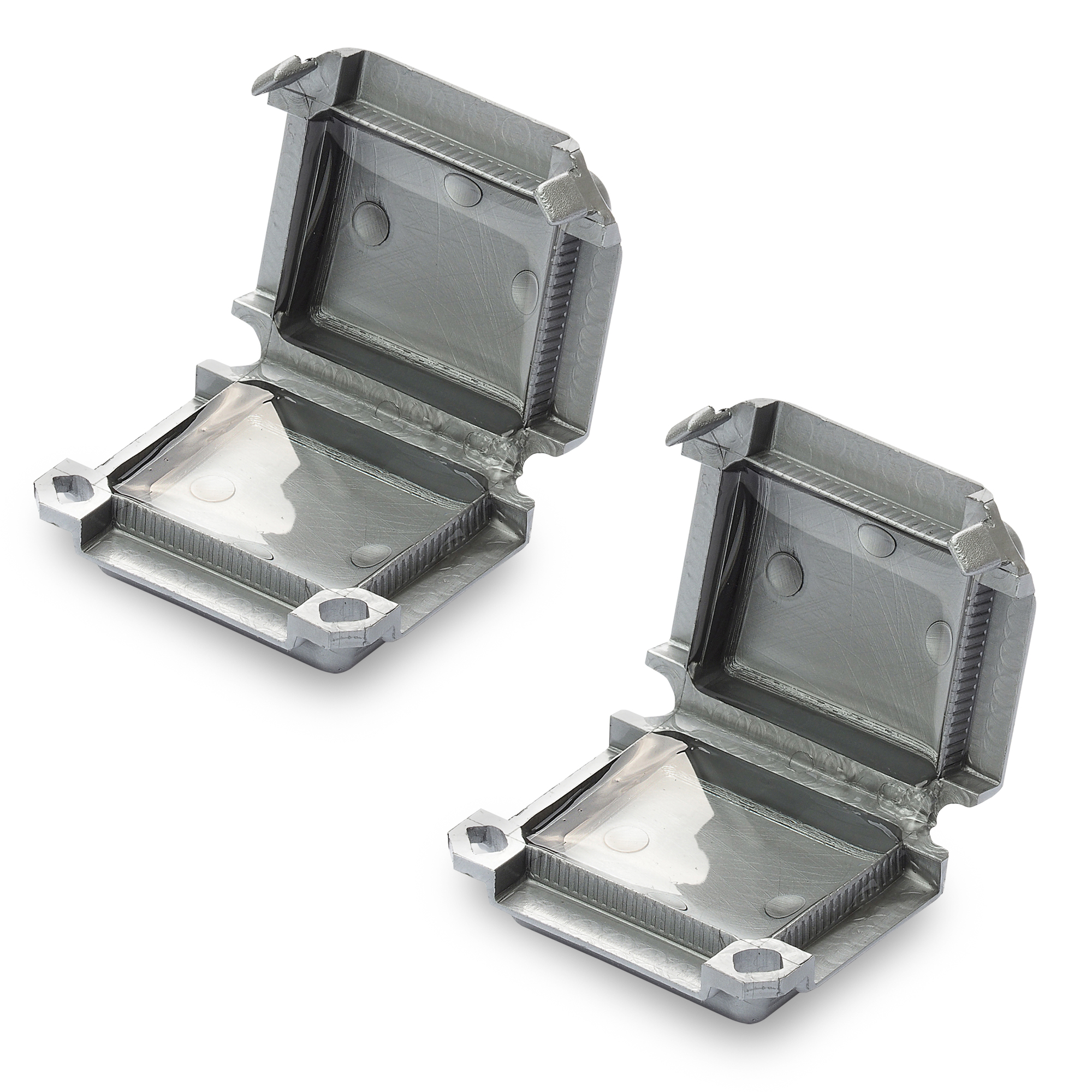 Zwei graue Mikro-Verbindungsmuffen, mit Gel gefüllt, halb geöffnet