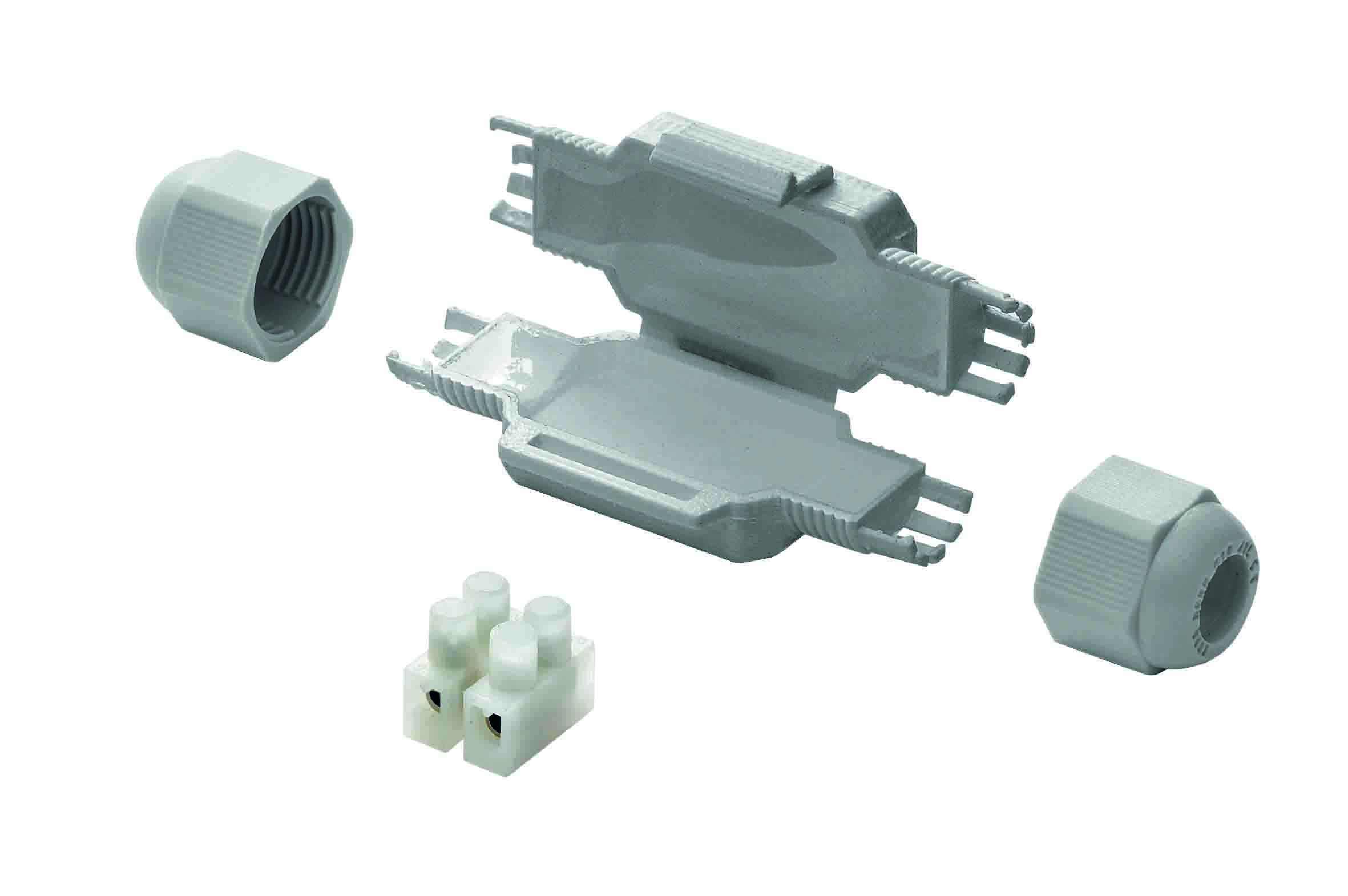 Graue Mikro-Verbindungsmuffe, daneben liegen eine Schraubklemme und Kabelverschraubungen